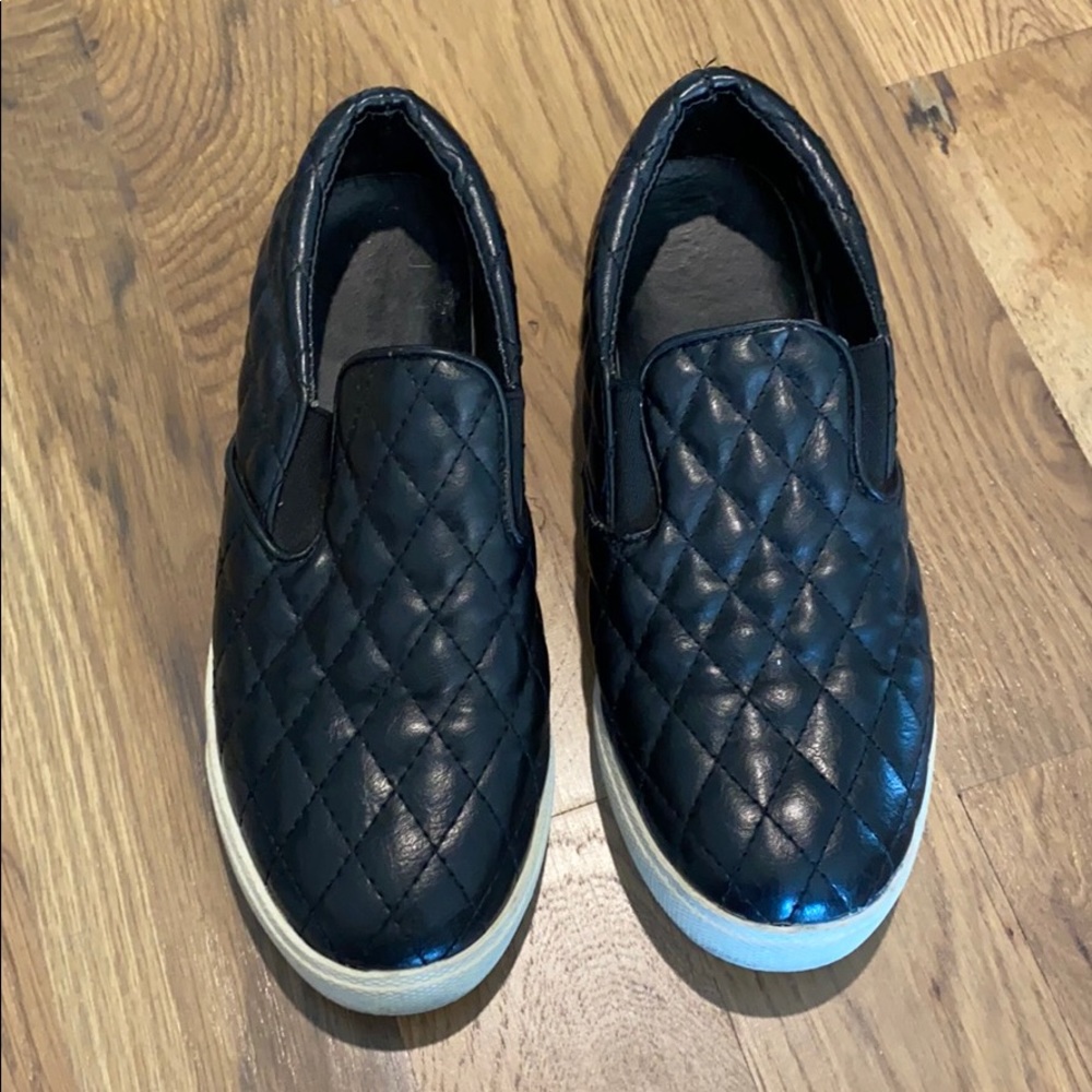pleated black slip ons